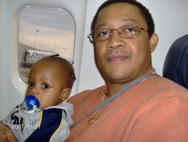 Tre (Robert Bryant, III) and grandson - Robert IV on plane to Nashville